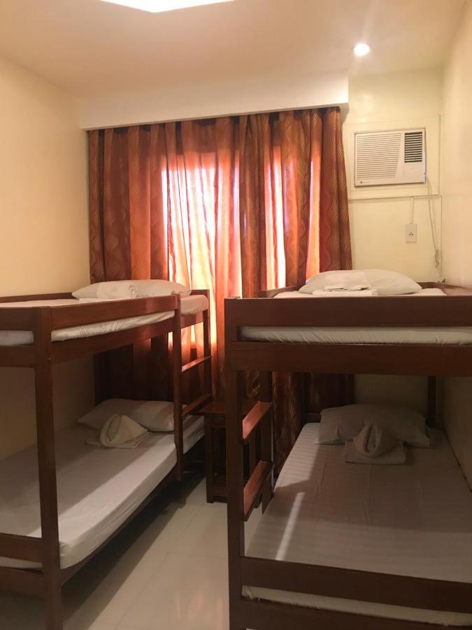 פורטו פרינססה Aquari Travellers Inn מראה חיצוני תמונה